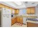 Bright kitchen featuring granite countertops and wood cabinets at 4551 W Continental Dr, Glendale, AZ 85308