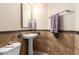 Powder room with pedestal sink and decorative tile at 4662 W Fallen Leaf Ln, Glendale, AZ 85310