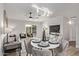 Open concept dining area with a view of the living room and kitchen at 6129 W Pierce St, Phoenix, AZ 85043