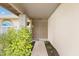 Covered entryway with an ornate security door and lush landscaping at 6608 W Mercer Ln, Glendale, AZ 85304