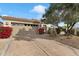 Tan stucco house with two-car garage and nicely landscaped front yard at 7979 E Princess Dr # 13, Scottsdale, AZ 85255