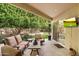 Relaxing patio with comfortable seating and a view of the backyard at 7979 E Princess Dr # 13, Scottsdale, AZ 85255