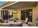Outdoor patio with seating area and access to the interior of the home at 7979 E Princess Dr # 13, Scottsdale, AZ 85255