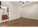 Bedroom with wood flooring and access to a private bathroom at 8102 W Autumn Vista Way, Florence, AZ 85132