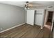 Spacious bedroom with mirrored closet doors and wood-look flooring at 9346 E Citrus N Ln, Sun Lakes, AZ 85248