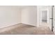 Spacious bedroom with neutral carpeting and access to another room at 942 E Beryl Ave, Phoenix, AZ 85020