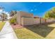 Property exterior showcasing tan stucco walls and landscaping at 942 E Beryl Ave, Phoenix, AZ 85020