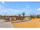 Modern playground with colorful elements and play structures at 944 W Saddle Run, Apache Junction, AZ 85120