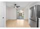 Dining area with sliding glass doors to backyard and ceiling fan at 946 E Diamond Dr, Tempe, AZ 85283