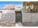 Tan stucco condo building with a gated entryway at 946 E Diamond Dr, Tempe, AZ 85283