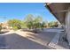 Landscaped backyard with gravel and trees at 9506 W Calico Dr, Sun City, AZ 85373