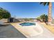 Kidney shaped pool with surrounding patio at 10425 N Balboa Dr, Sun City, AZ 85351