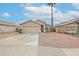 Cute single story house with a two-car garage and desert landscaping at 11329 E Caballero St, Mesa, AZ 85207