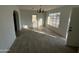 Bright living room with hardwood floors and chandelier at 114 E 12Th St, Eloy, AZ 85131