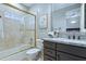 Bathroom with tub, shower, and granite vanity at 11696 E Charter Oak Dr, Scottsdale, AZ 85259