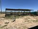 Several animal pens with covered shelter in the backyard at 12601 S Hermit Rd, Buckeye, AZ 85326