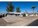 Ranch-style home with a gray exterior and a spacious driveway at 12640 N Pebble Beach Dr, Sun City, AZ 85351