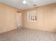 Living Room with tile floors and window with plantation shutters at 15224 W Pasadena Dr, Surprise, AZ 85374