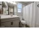 Clean bathroom with a single vanity, toilet, and shower/tub combo at 16071 W Sand Hills Rd, Surprise, AZ 85387