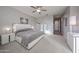 Spacious primary bedroom with carpeted floors and en-suite bathroom at 16071 W Sand Hills Rd, Surprise, AZ 85387