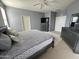 Main bedroom with large bed, dresser, and walk-in closet at 17713 W Post Dr, Surprise, AZ 85388