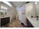 Large bathroom with double sinks, walk-in shower, and stylish tile at 19418 N 86Th Dr, Peoria, AZ 85382