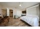 Comfortable bedroom with a queen bed and a wall-mounted TV at 19418 N 86Th Dr, Peoria, AZ 85382