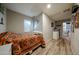 Small bedroom with a twin-size bed and wood flooring at 19418 N 86Th Dr, Peoria, AZ 85382