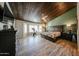 Spacious main bedroom with wood-look floors, and an en-suite bathroom at 19418 N 86Th Dr, Peoria, AZ 85382