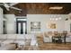 Open concept dining area with wood table and access to the kitchen at 19418 N 86Th Dr, Peoria, AZ 85382