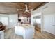 Large kitchen island with granite countertop and seating for three at 19418 N 86Th Dr, Peoria, AZ 85382