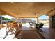 Relaxing covered patio with outdoor furniture and fire pit at 19418 N 86Th Dr, Peoria, AZ 85382