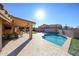 Inviting backyard oasis with a sparkling pool and patio area at 19418 N 86Th Dr, Peoria, AZ 85382