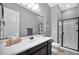 Bathroom featuring single vanity, walk-in shower, and modern fixtures at 21448 E Arroyo Verde Dr, Queen Creek, AZ 85142