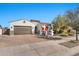 Inviting front yard with a charming exterior and holiday decorations at 21448 E Arroyo Verde Dr, Queen Creek, AZ 85142