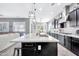 View of the kitchen island with sink, pendant lights, and open layout at 21448 E Arroyo Verde Dr, Queen Creek, AZ 85142