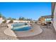 Inviting pool with a baja step and surrounding desert landscaping at 21448 E Arroyo Verde Dr, Queen Creek, AZ 85142