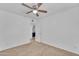 Bedroom with ceiling fan and view of another room at 2308 E Chipman Rd, Phoenix, AZ 85040