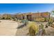 Desert landscape surrounds this beautiful home's exterior at 24200 N Alma School Rd # 29, Scottsdale, AZ 85255