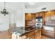 Kitchen island with granite countertop and cooktop at 24200 N Alma School Rd # 29, Scottsdale, AZ 85255