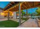 Relaxing covered patio with a ping pong table and artificial turf at 2911 E Morrison Ranch Pkwy, Gilbert, AZ 85296