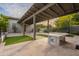 Covered patio with ping pong table and artificial turf at 2911 E Morrison Ranch Pkwy, Gilbert, AZ 85296