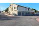 Building exterior featuring multiple garages and parking spaces at 30 E Brown Rd # 2094, Mesa, AZ 85201