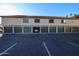 Building exterior showcasing six garages and ample parking at 30 E Brown Rd # 2094, Mesa, AZ 85201