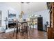 Charming breakfast nook with a glass-top table and hardwood floors at 3146 N 157Th Ln, Goodyear, AZ 85395