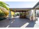 Covered patio with an outdoor kitchen and seating area at 3612 E Powell Way, Gilbert, AZ 85298