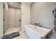 Modern bathroom featuring a large walk-in shower and a free-standing bathtub at 37200 N Cave Creek Rd # 1119, Scottsdale, AZ 85262