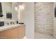 Elegant powder room with light stone wall and modern vanity at 37200 N Cave Creek Rd # 1119, Scottsdale, AZ 85262