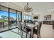 Modern dining area with large windows and view of patio at 37200 N Cave Creek Rd # 1119, Scottsdale, AZ 85262