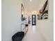 Bright entryway with contemporary console table and art at 37200 N Cave Creek Rd # 1119, Scottsdale, AZ 85262